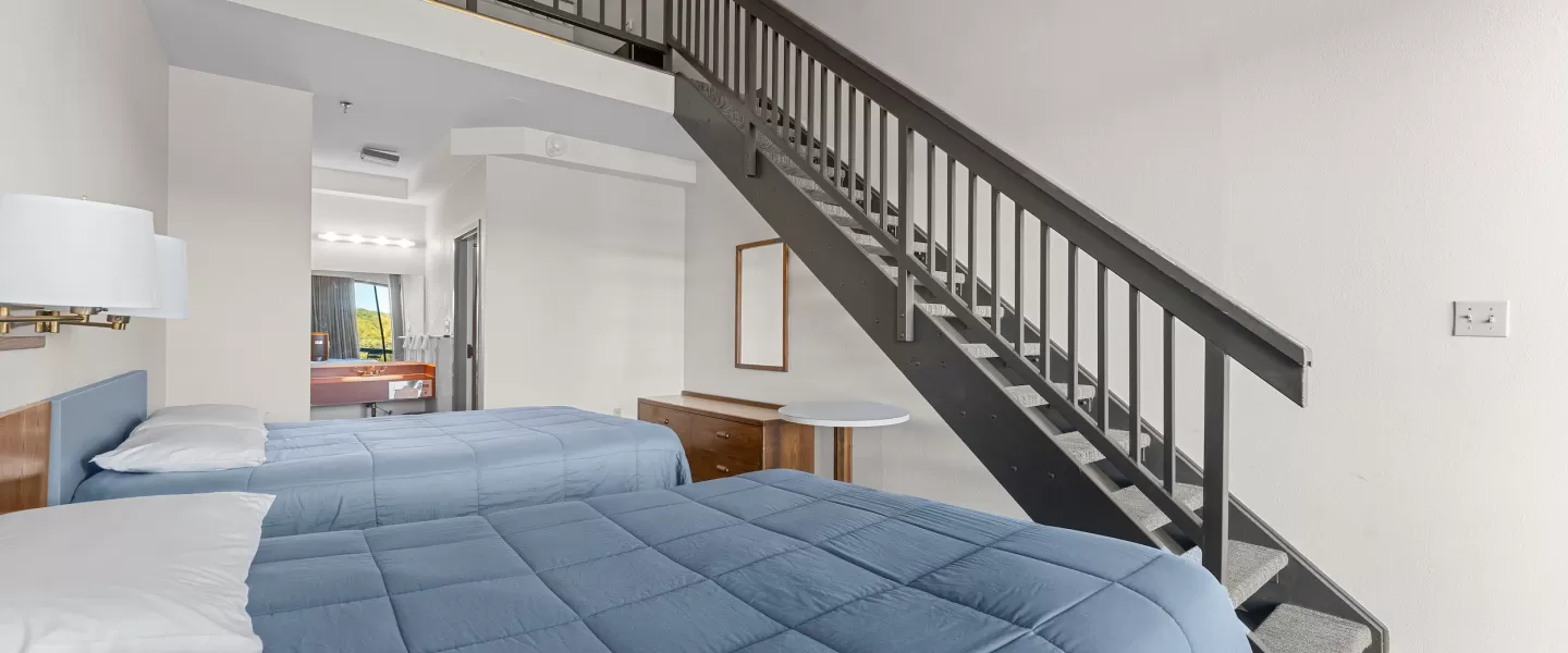 YMCA Trout Lodge in Potosi, MO Hotel Lodge Loft Room with Queen Beds, Dressers, Powder Sink, and Bathroom