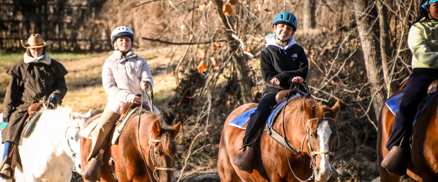School group goes on a horseback trail ride as an Outdoor Education program activity add-on