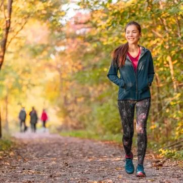 happy woman walking in nature