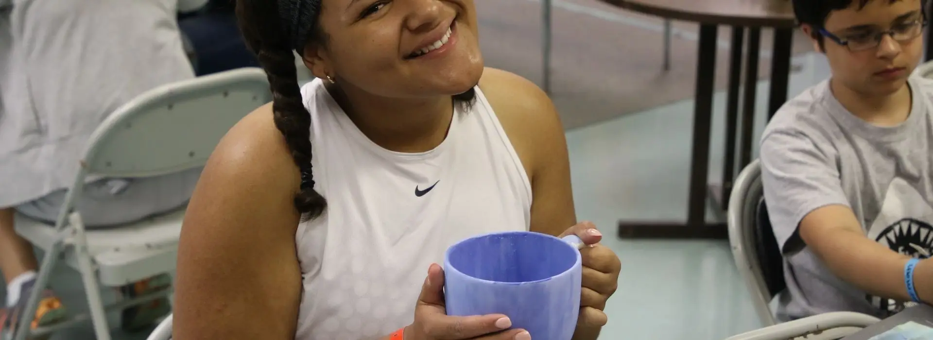 Girl painting a blue bowl