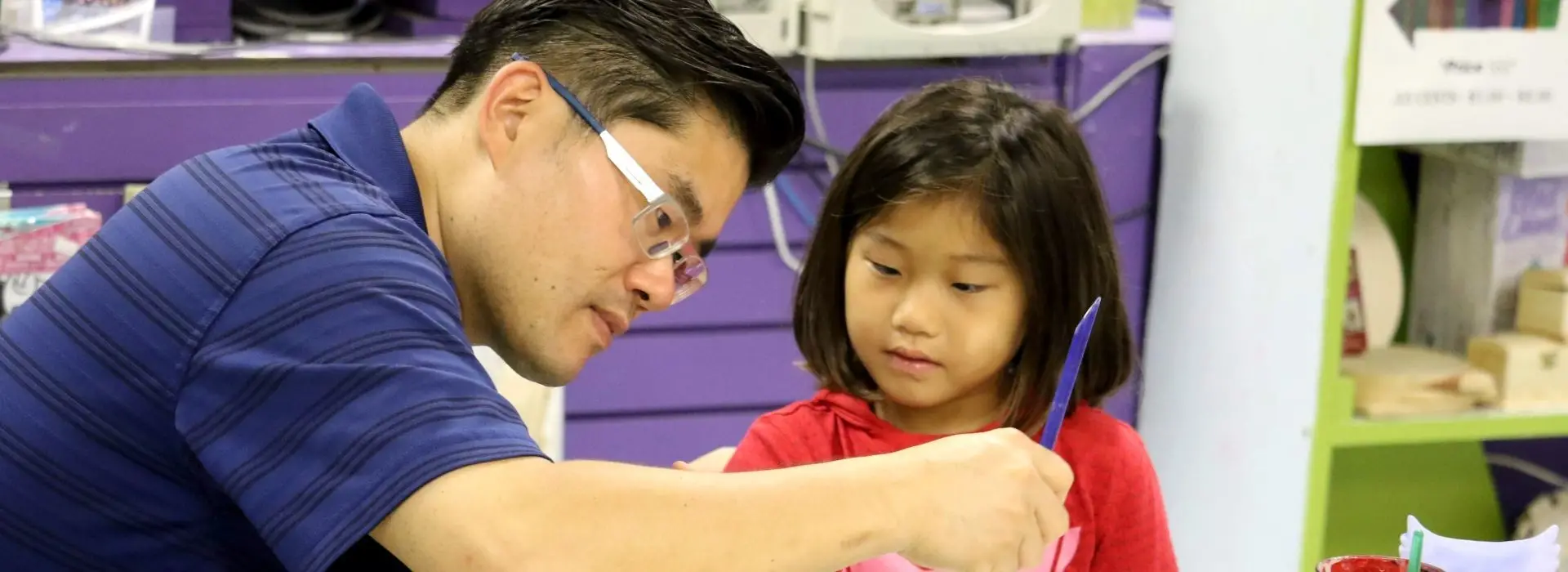 Father and daughter painting