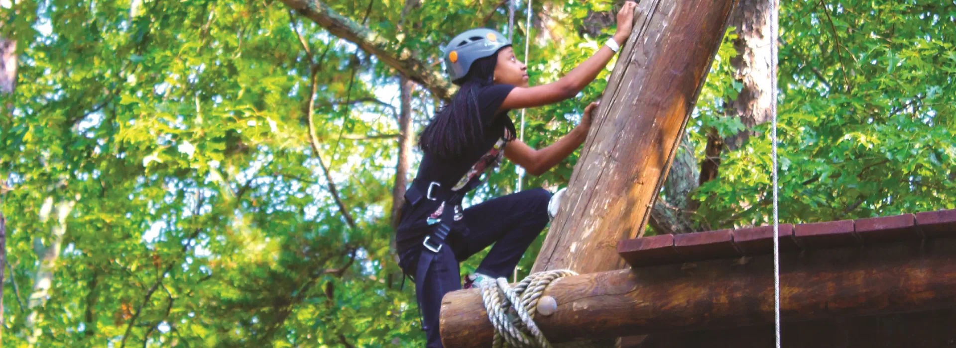 girl climbing tall alpine tower