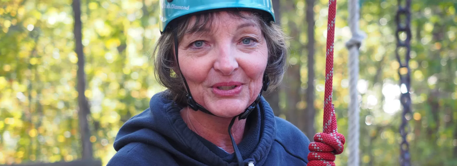 woman geared up to climb alpine tower
