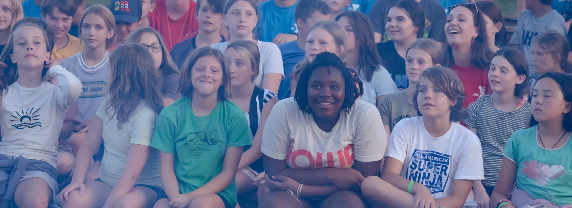 Crowd of campers at campfire