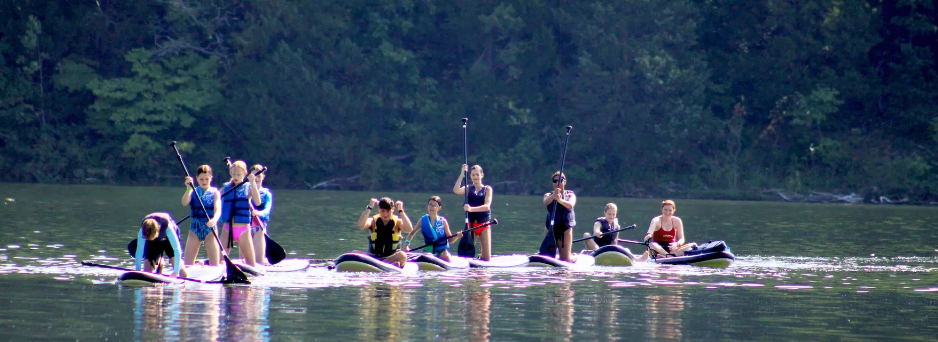 ymca camp lakewood waterfront photo of campers on paddleboards