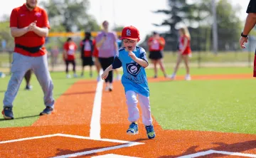 YMCA Adaptive Sports Complex Boy Scoring at Home Base